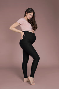 maternity leggings with a built-in support belt from a side view.